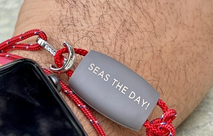 A Virgin Voyages Band on a Sailor's wrist
