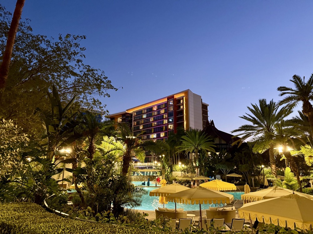 Disneyland Hotel pool and tower at dusk
