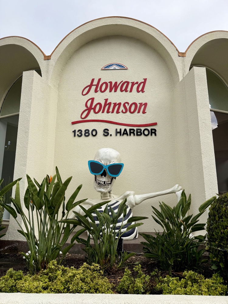 Howard Johnson Anaheim hotel sign with Halloween skeleton decoration