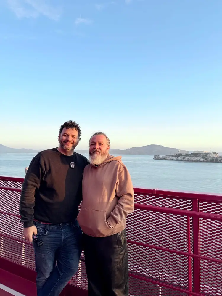 Kieran and Phil on the deck of Brilliant Lady with Alcatraz behind them