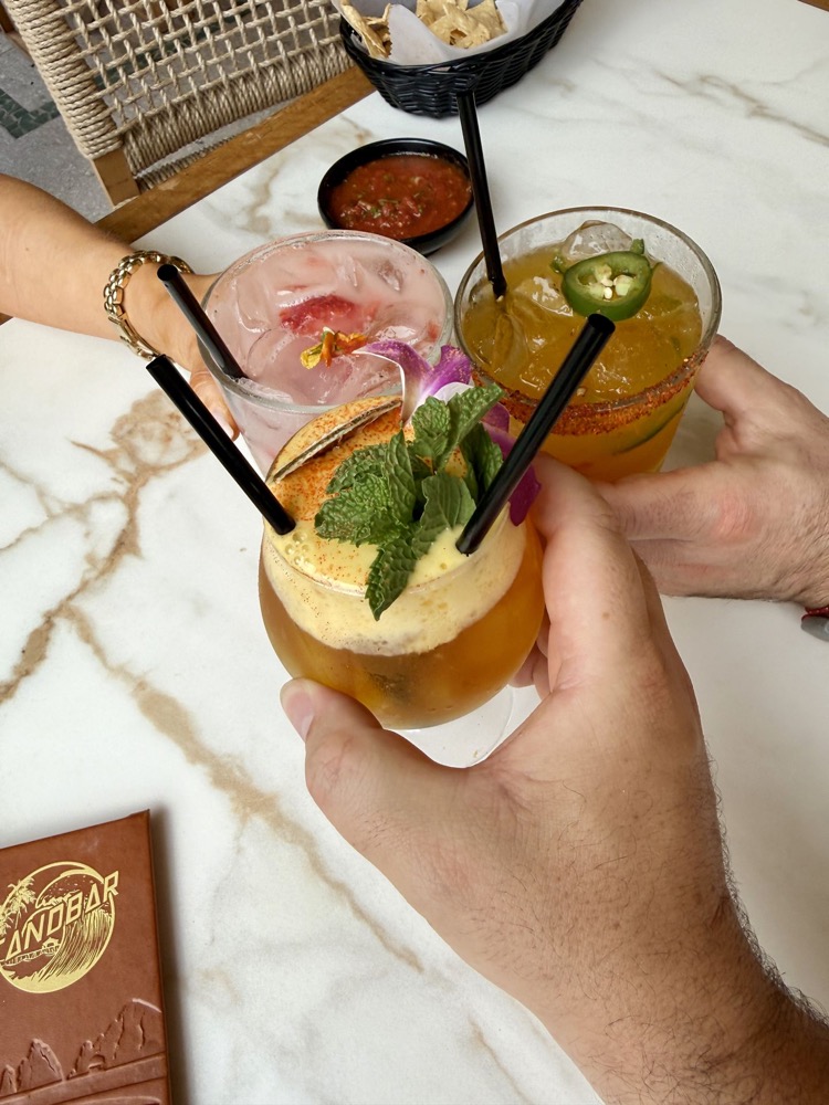 Cheers with mai tais at Sandbar in Santa Barbara