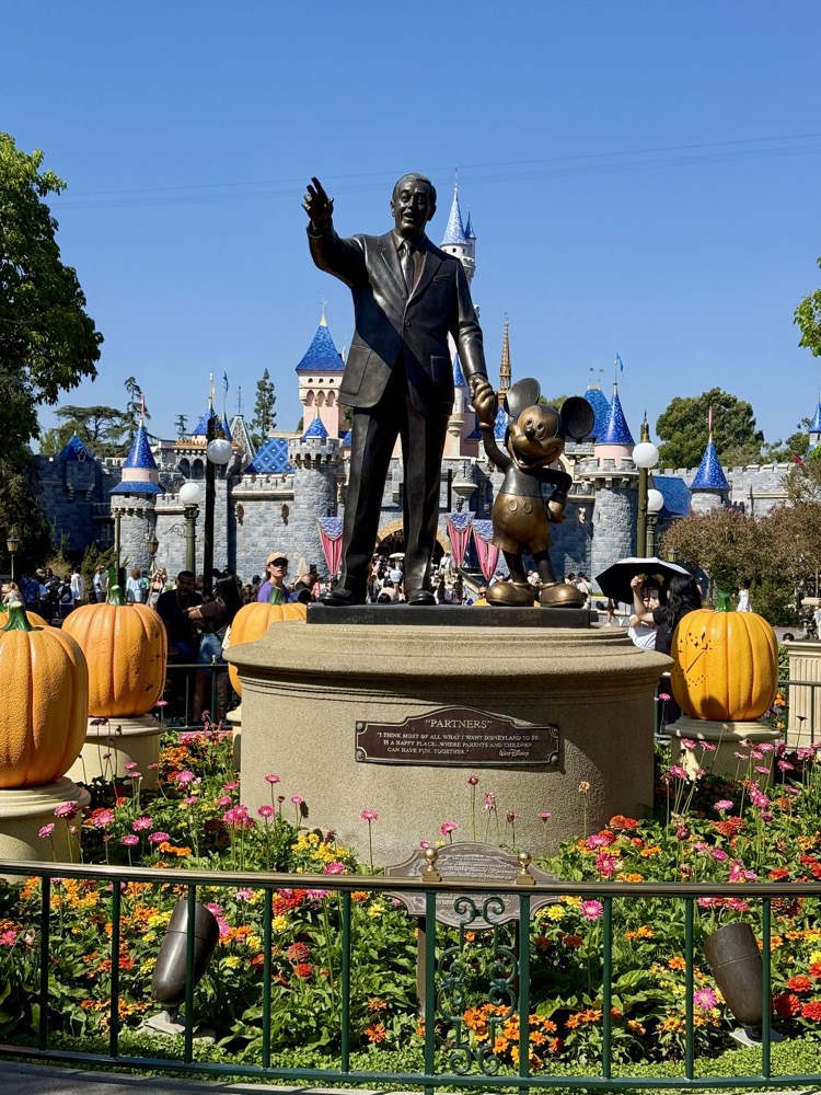 Walt and Mickey Partners statue with Halloween pumpkins at Disneyland