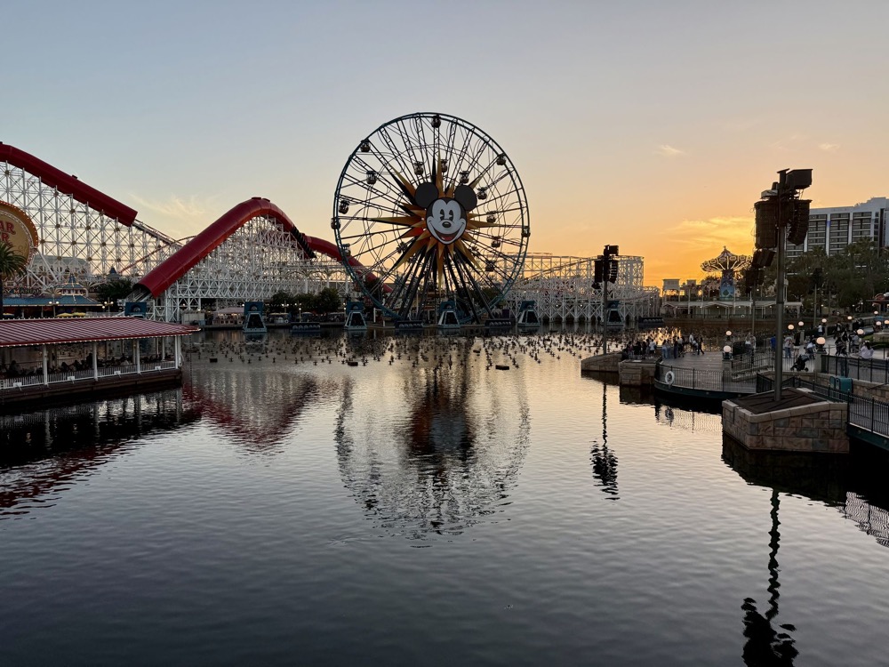Pixar Pier reflected in Paradise Bay at sunset