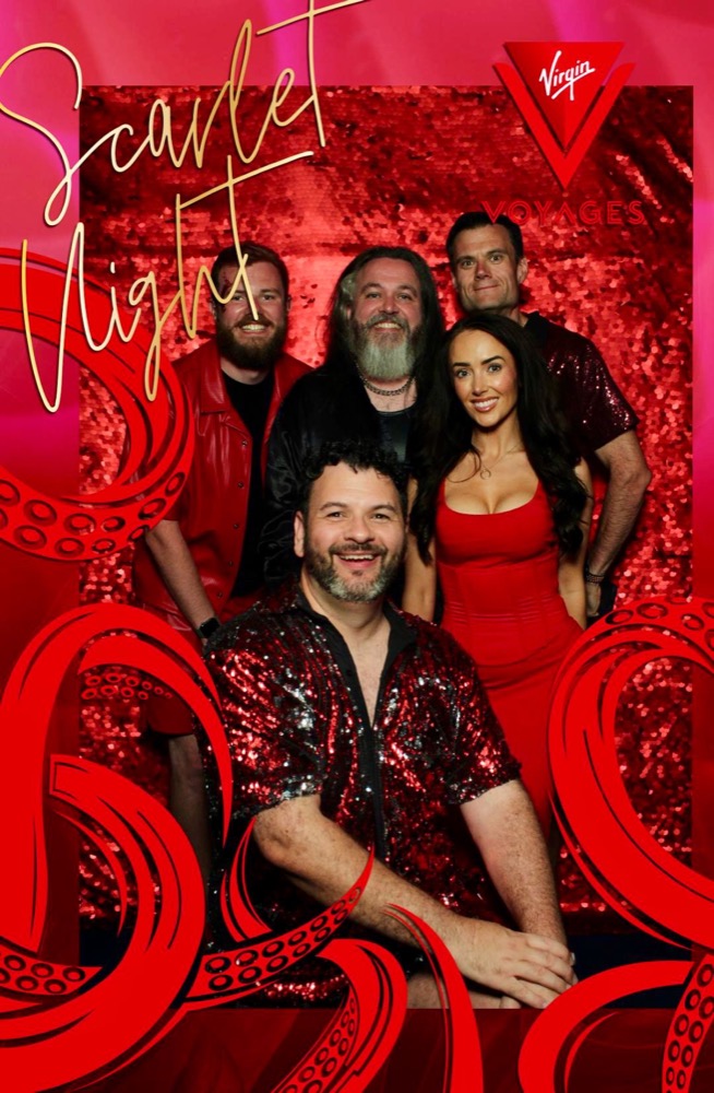 Group photo in red at the Scarlet Night photo wall on Brilliant Lady