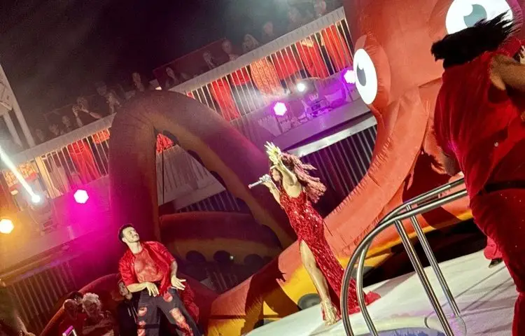 Performers on the pool deck during Scarlet Night on Brilliant Lady