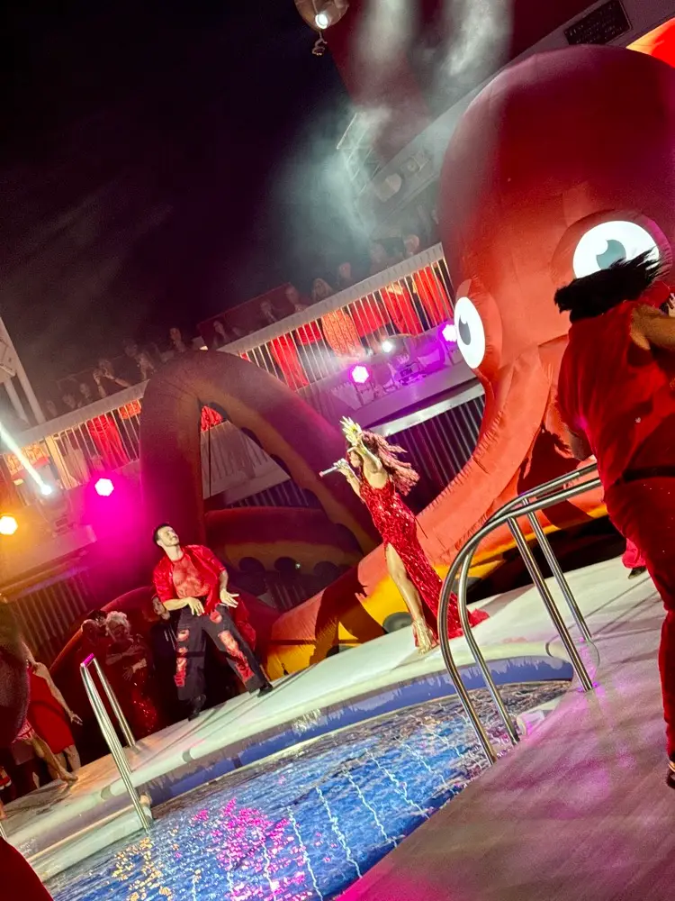 Performers on the pool deck during Scarlet Night on Brilliant Lady