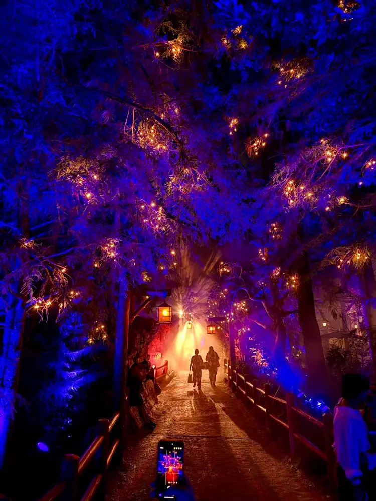 Glowing trees in Villains Grove at Oogie Boogie Bash