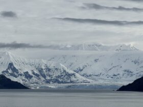 Calm water and snowy mountains in Alaska from Brilliant Lady