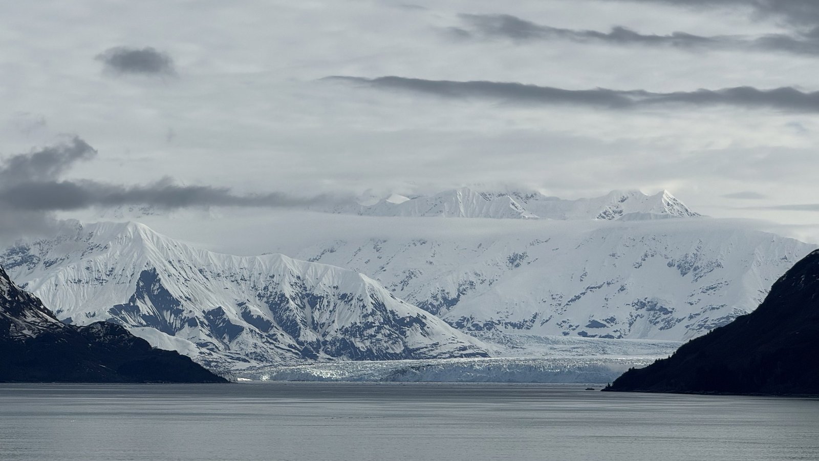 Calm water and snowy mountains in Alaska from Brilliant Lady