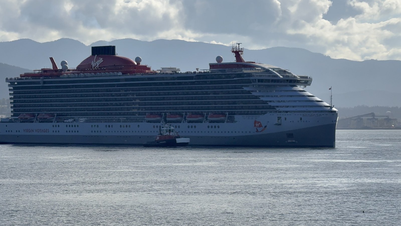 Brilliant Lady in Vancouver harbour with mountains behind