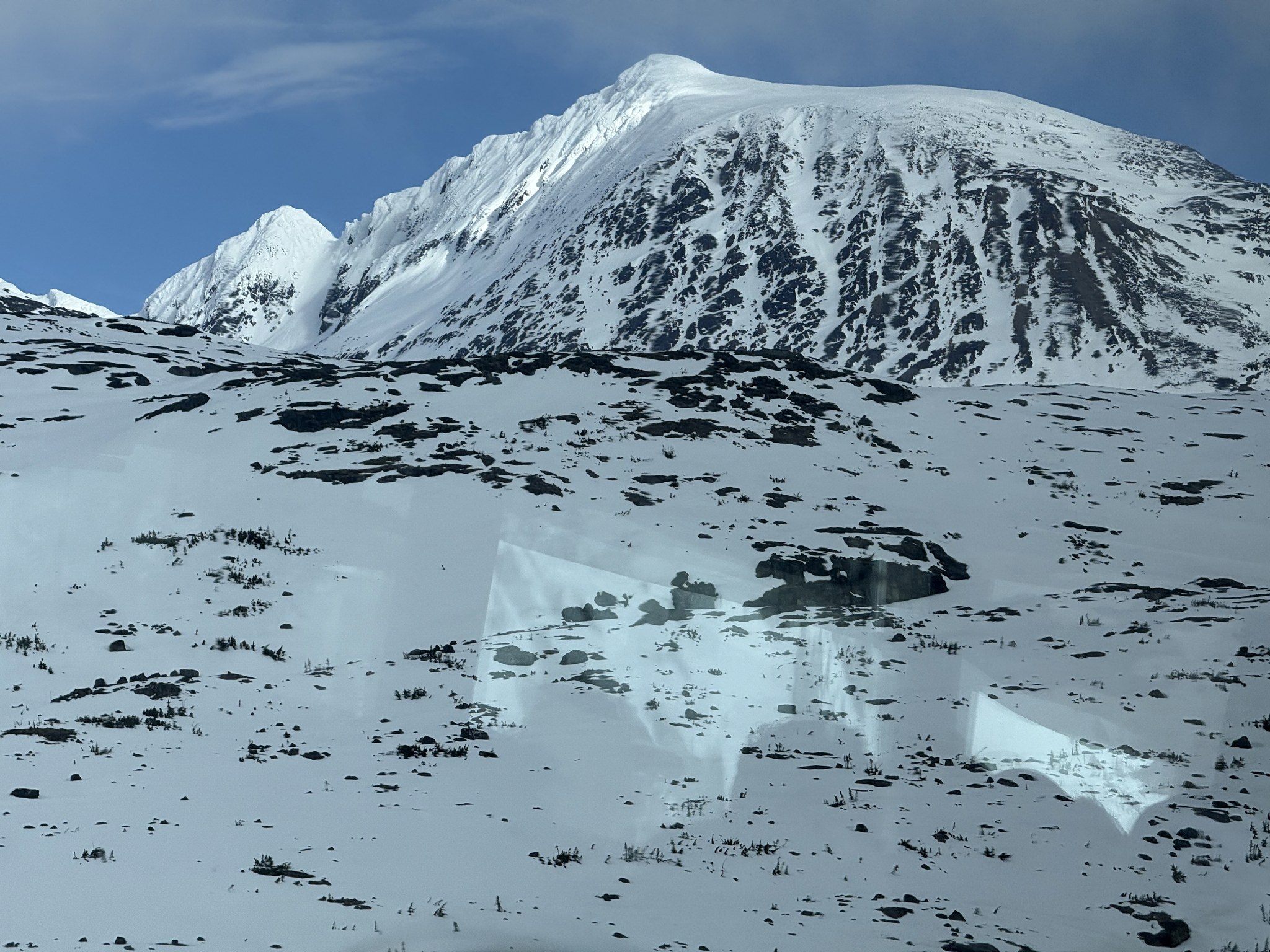 Snow-covered mountains at the White Pass summit near Skagway in May