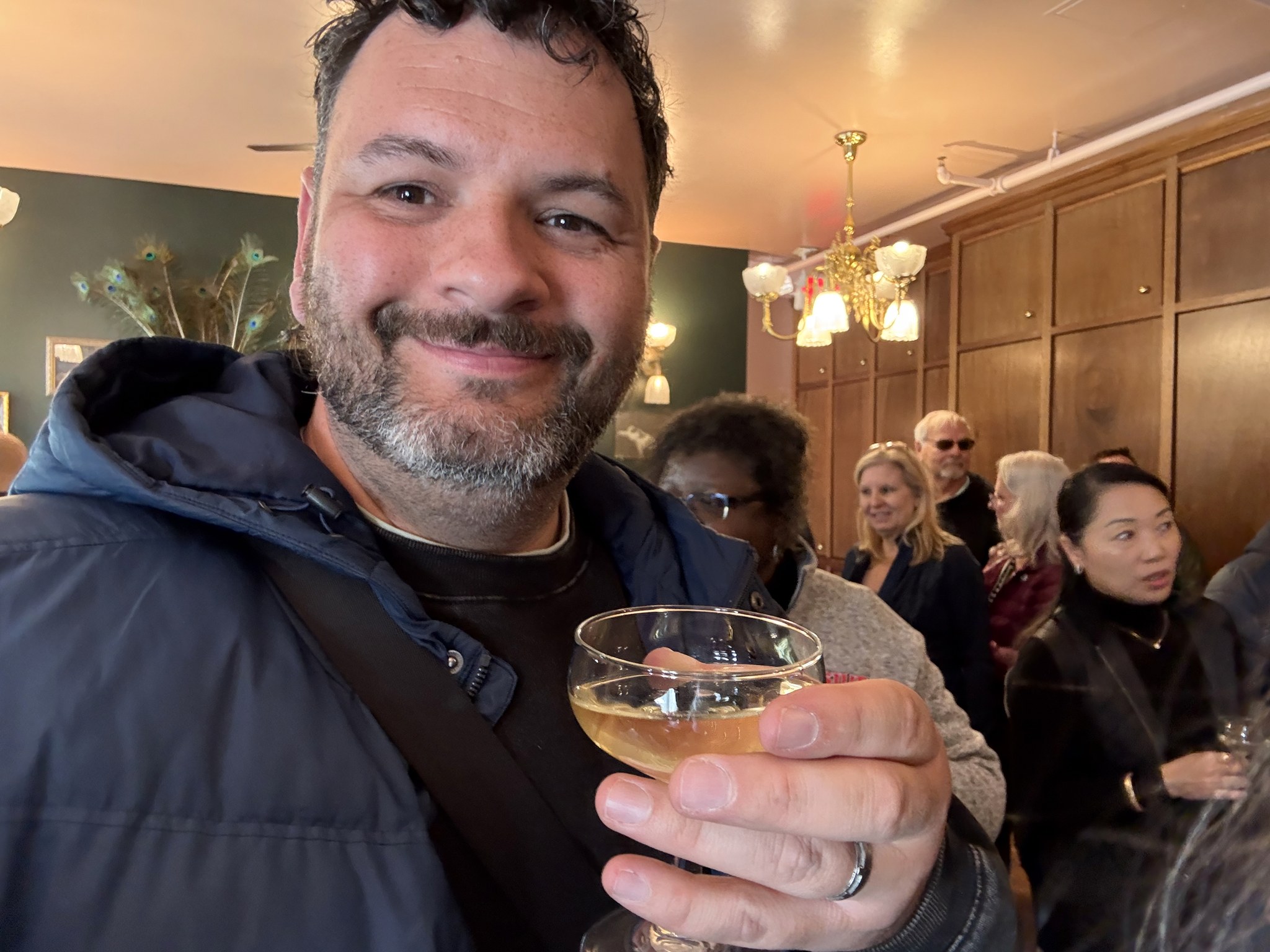 Kieran with a glass of champagne at the Red Onion Saloon in Skagway