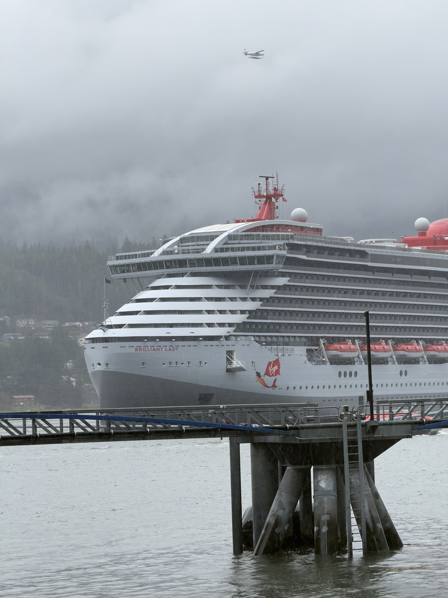 Virgin Voyages ship with its red logo in Juneau, Alaska