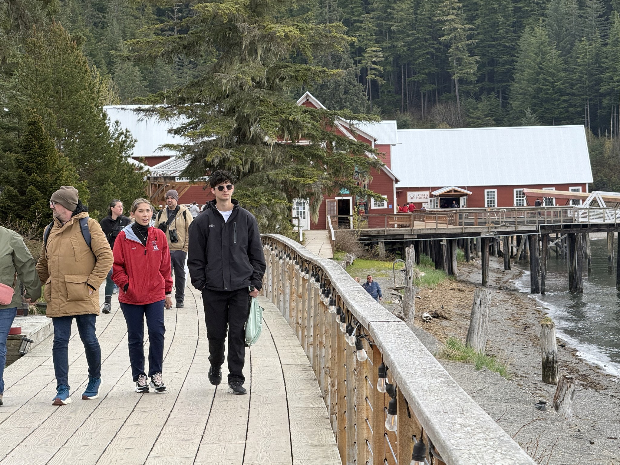 Walking the waterfront boardwalk towards the old cannery at Icy Strait Point