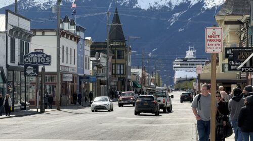 Skagway's main street with snowy mountains behind
