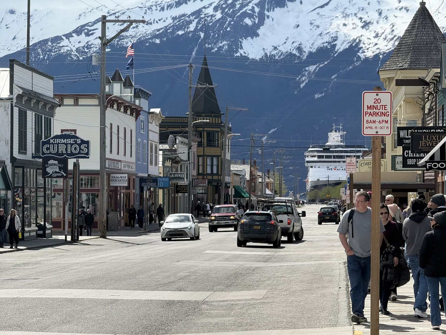 Skagway's main street with snowy mountains behind