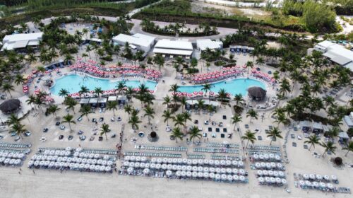Aerial view of Virgin Voyages' Beach Club at Bimini, with the pool, loungers and beach