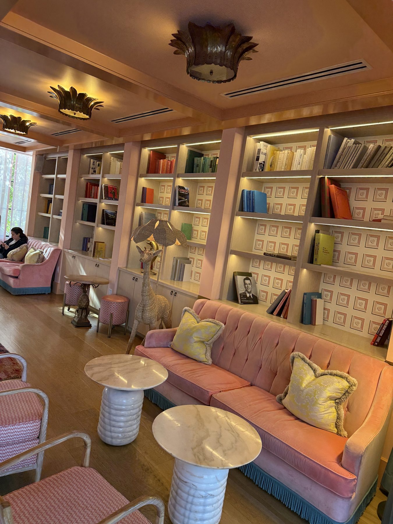 The pink and green library lounge at The Goodtime Hotel, South Beach