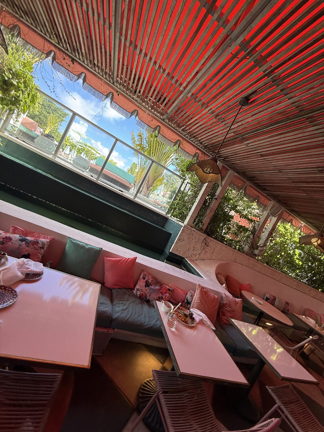Pink tables on the terrace restaurant at The Goodtime Hotel