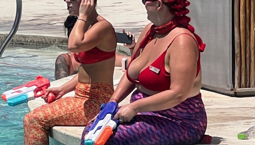 Mermaid performers on the edge of the pool at the Beach Club at Bimini