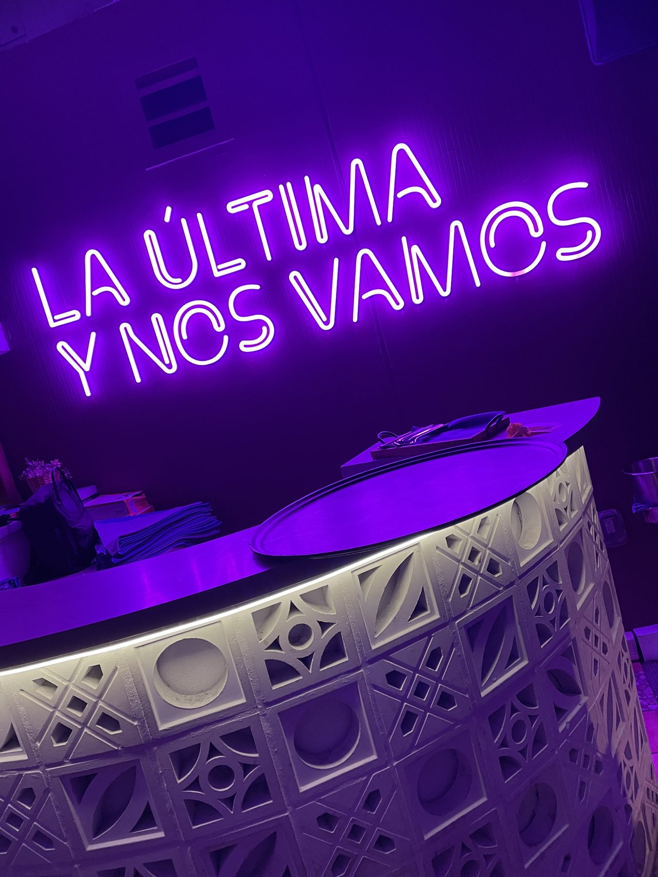 A purple neon sign in the bar at Moxy South Beach