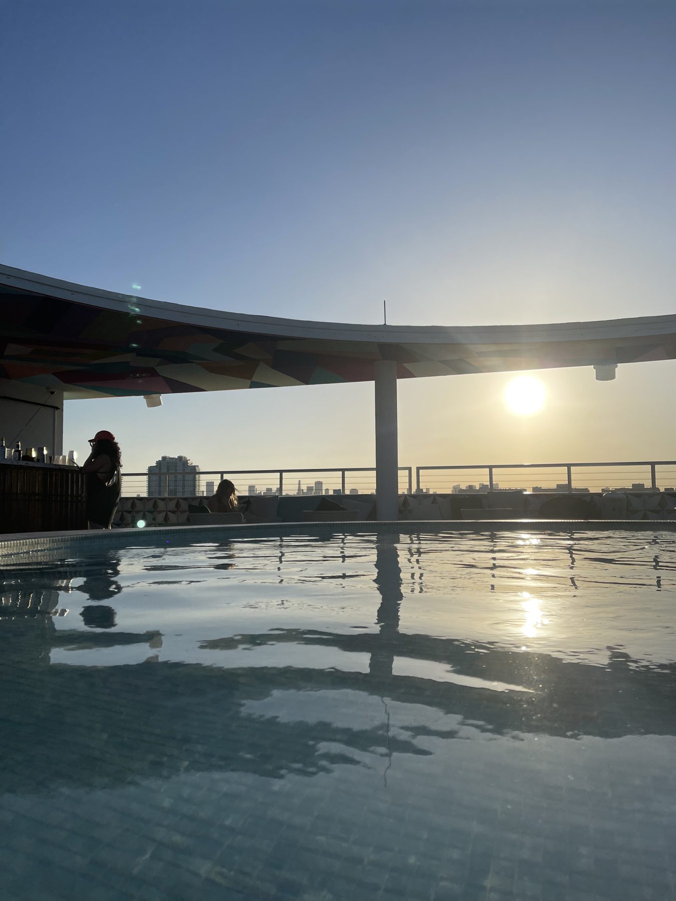 The rooftop pool at Moxy South Beach at sunset