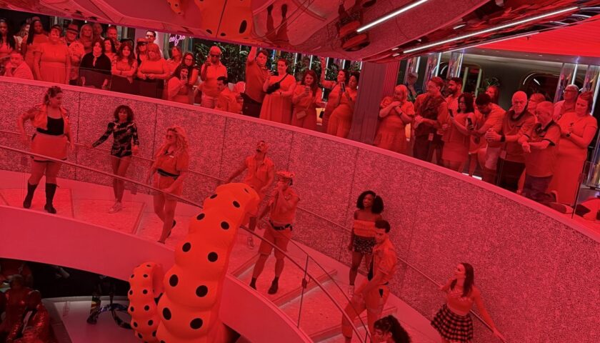 Dancers on the red spiral staircase at Scarlet Night