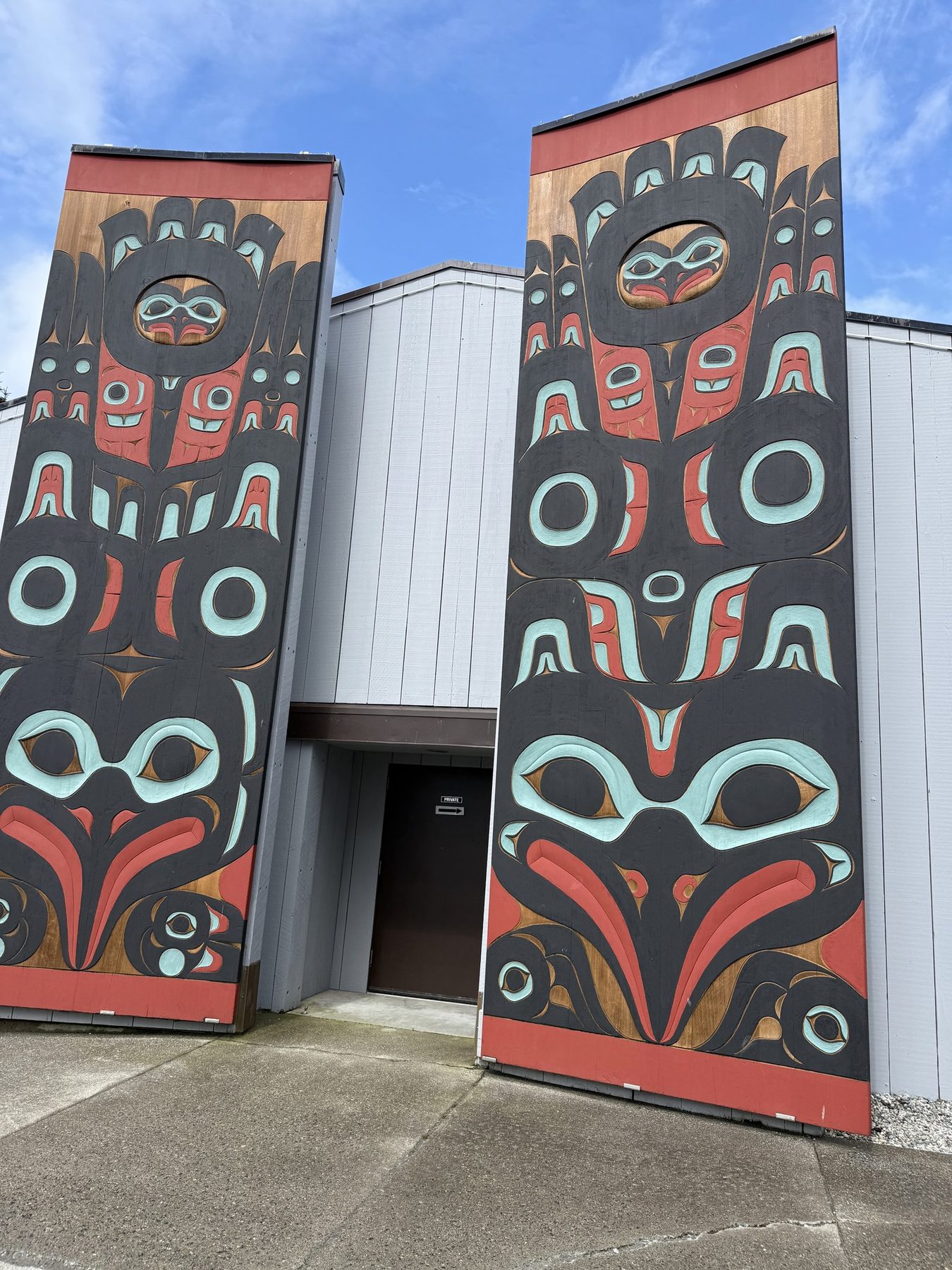 Tlingit art panels outside Harrigan Centennial Hall in Sitka