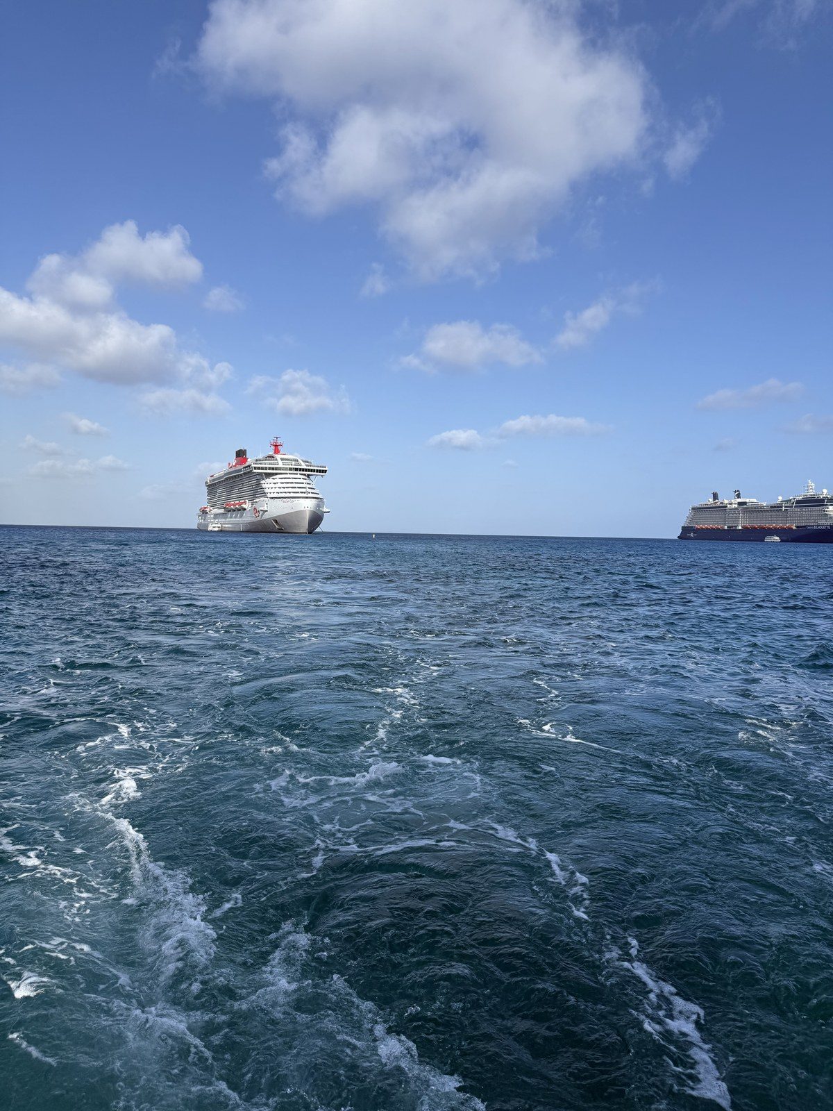 Heading ashore by tender at Grand Cayman with cruise ships at anchor behind