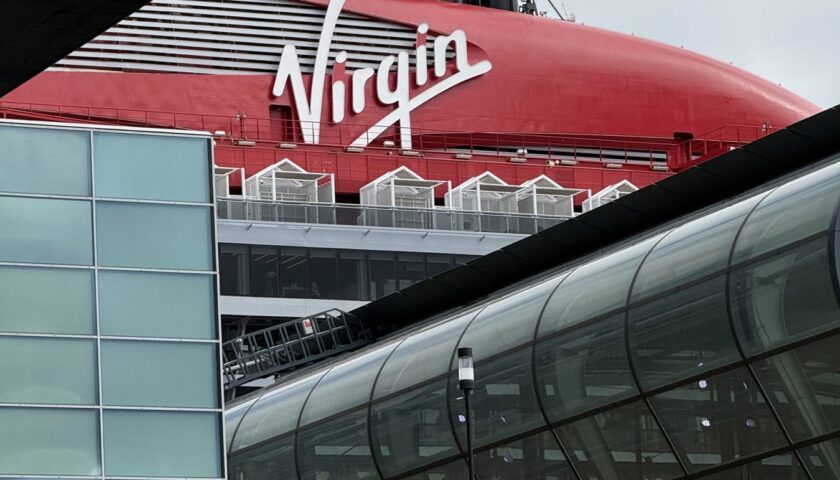 Valiant Lady's red funnel behind the cruise terminal in Amsterdam