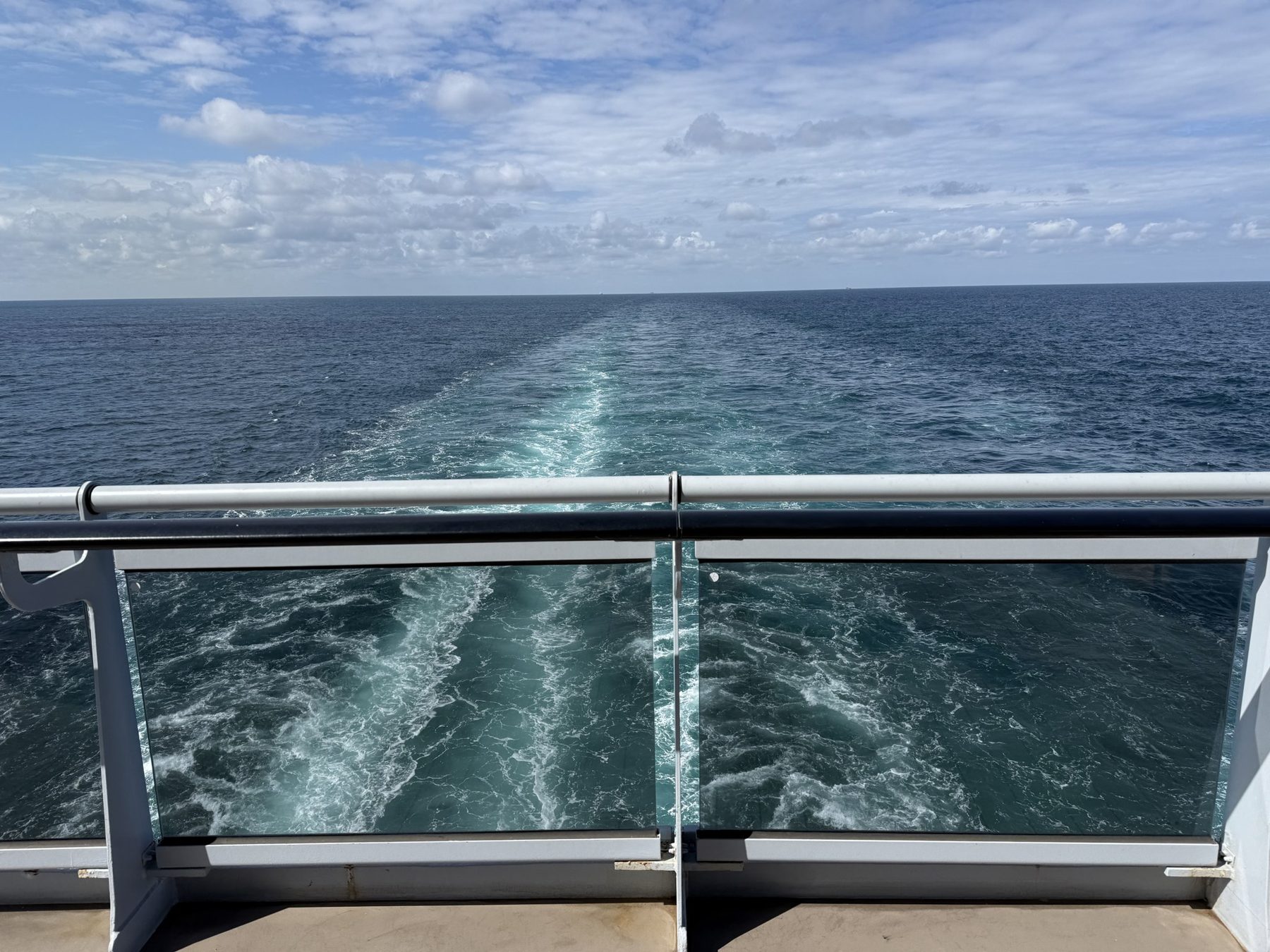 The wake of Valiant Lady seen from the aft deck on calm seas
