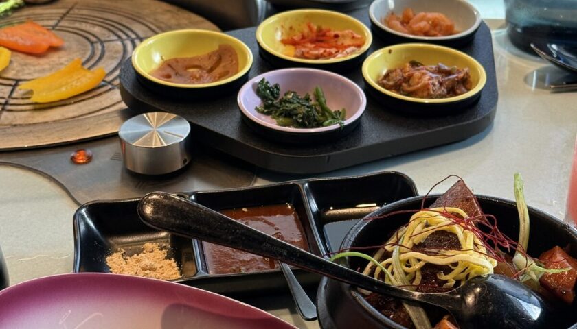 Korean barbecue table and banchan at Gunbae on Resilient Lady
