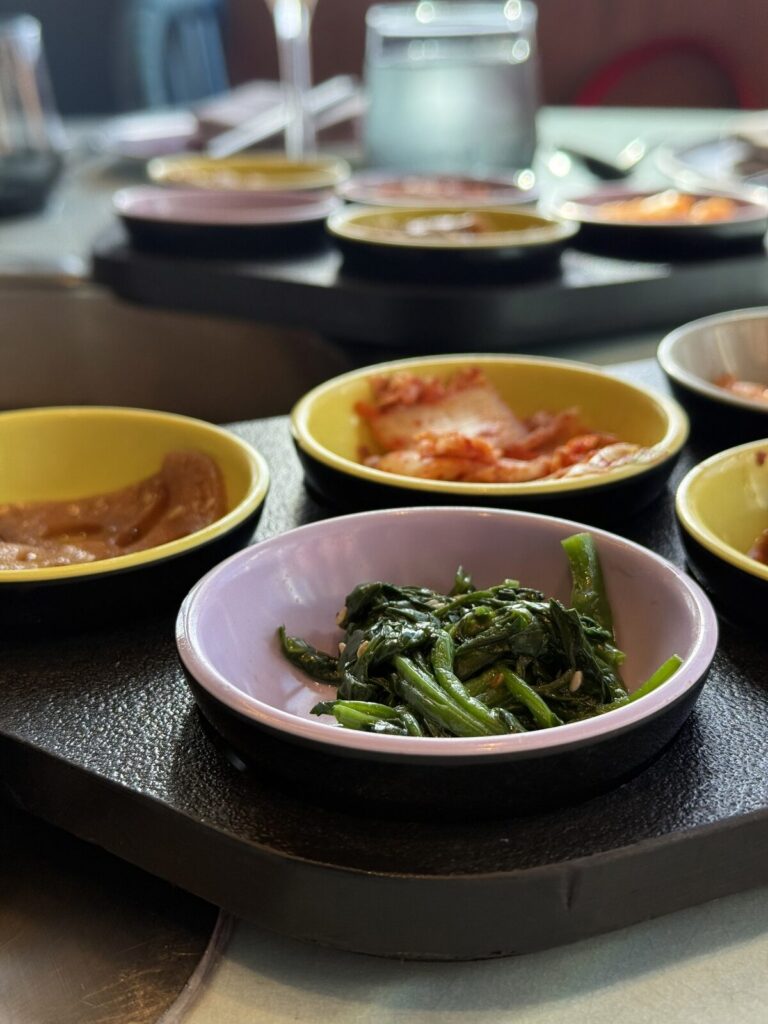 Kimchi and side dishes at Gunbae on Resilient Lady