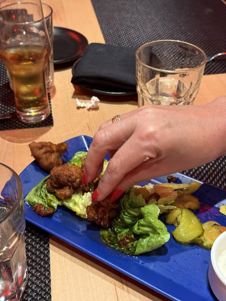 Sharing chicken at Razzle Dazzle on Resilient Lady