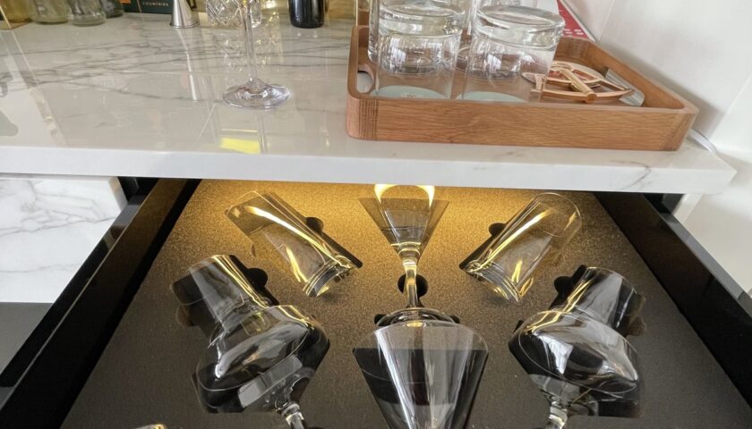 Cocktail glasses and decanters in a RockStar suite bar drawer