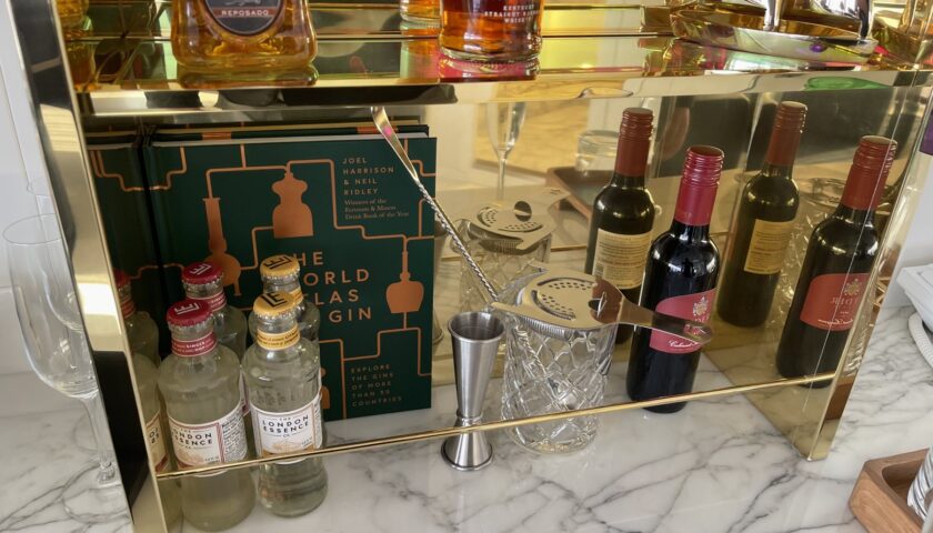 The stocked in-suite bar in a Virgin Voyages RockStar suite