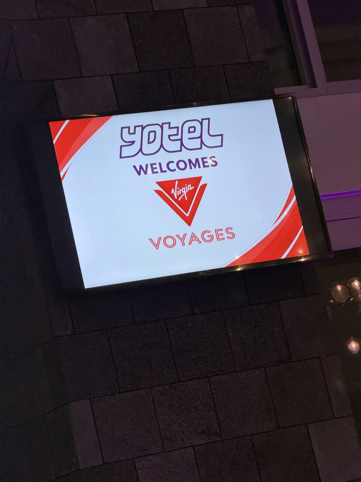 A Virgin Voyages welcome screen in our room at the YOTEL in downtown Miami